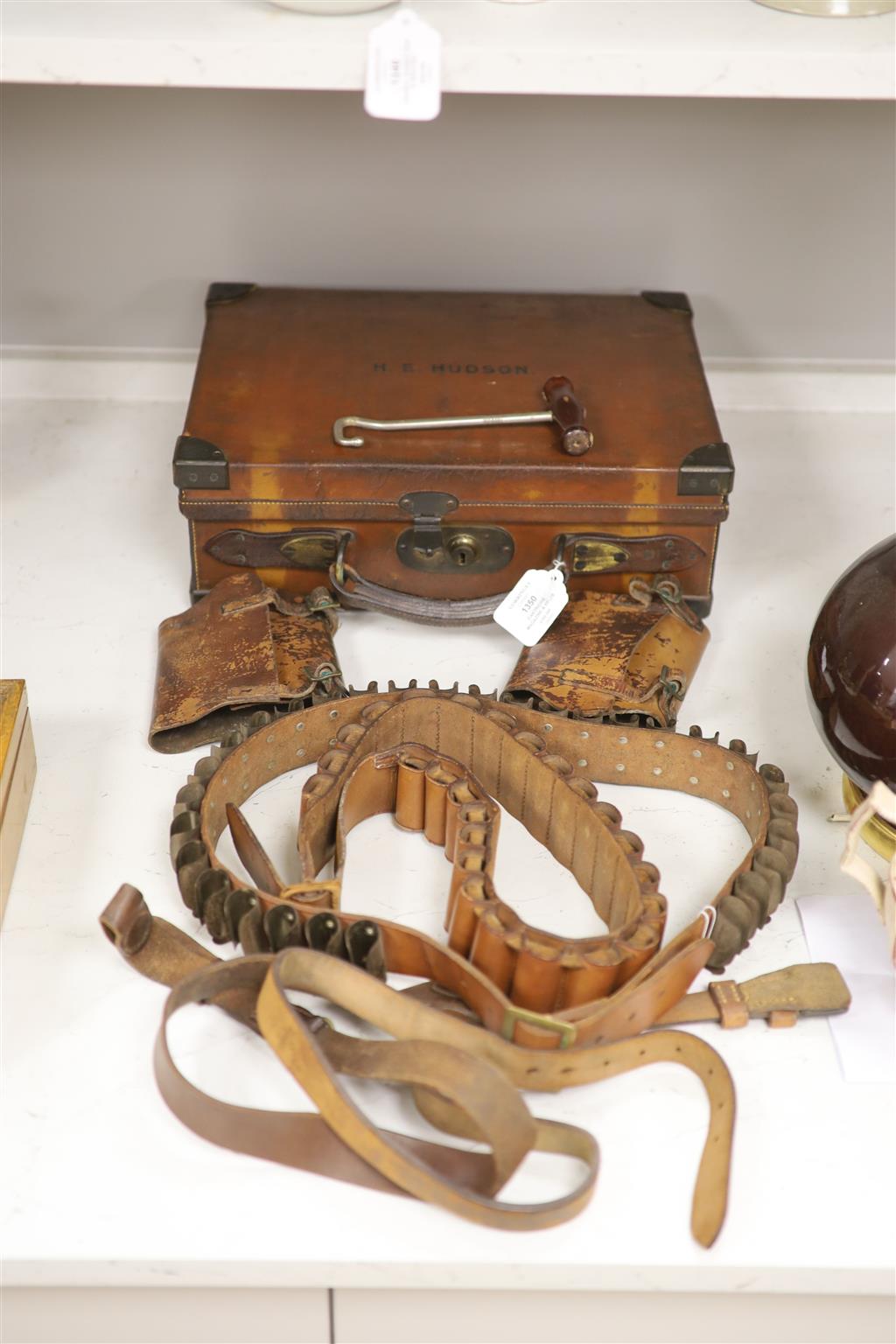An Edwardian leather cartridge magazine and belts, case 36.5cm wide, 29cm deep